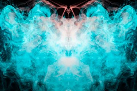 A multi-colored pattern of green and red smoke of a mystical shape in the for 스톡 사진