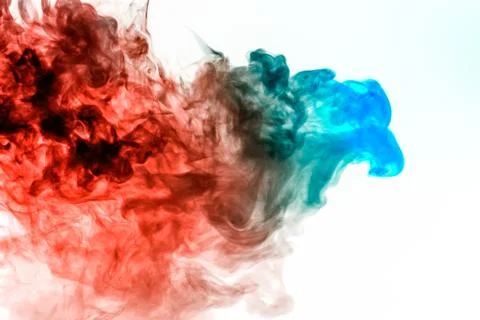 A multi-colored pattern of green and red smoke of a mystical shape in the for Stock Photos