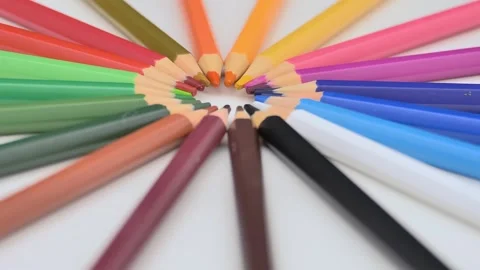 Multi-colored pencils lie on a white background. Bright colored pencils rotate Video stock 253074572