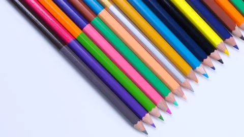 Multi-colored pencils stacked in a row close-up on a white background, Stock Footage 213515756