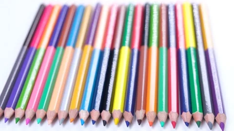 Multi-colored pencils stacked in a row close-up on a white background Stock Footage 218841333