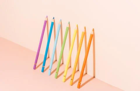 Multi-colored pencils under hard light on a light background Stock-Fotos