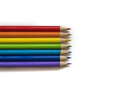 Multi colored pencils on white background Stock Photos