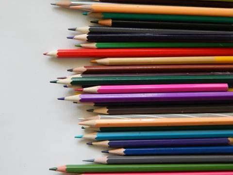 Multi-colored pencils on white background Stock Photos