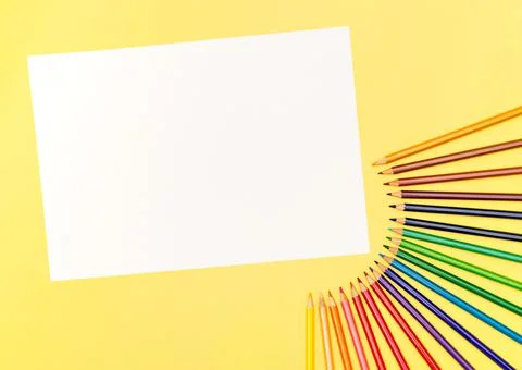 Multi-colored pencils on a yellow background. View from above. Copy space Stock-Fotos