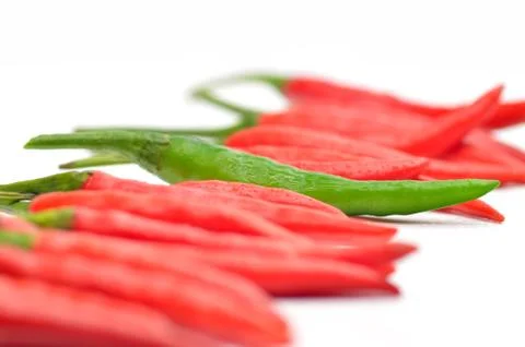 Multi-colored peppers on a white background Stock Photos