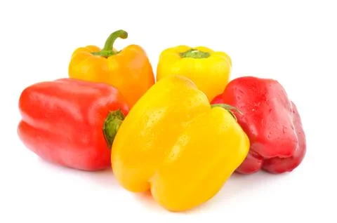 Multi-colored peppers on a white background Stock Photos