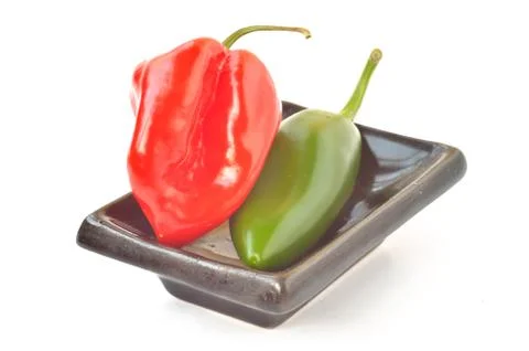 Multi-colored peppers on a white background Stock Photos