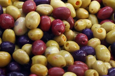 Multi colored pickled olives in close up Stock Photos