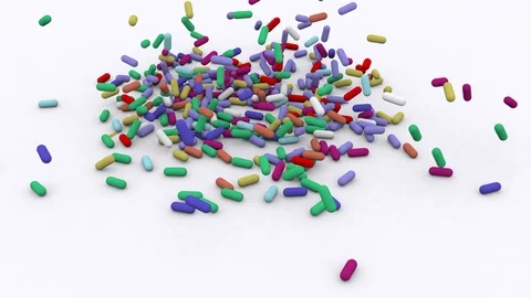 Multi-colored pills fall Stock Footage 104236330