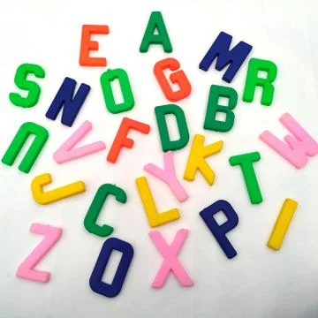 Multi colored plastic alphabet isolated on white background Stock Photos