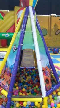 Multi-colored plastic balls. A children's playroom. beautiful toys Stock Photos