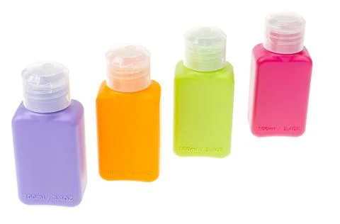 Multi-colored plastic bottles, containers isolated on white background Stock Photos