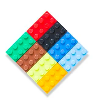 Multi-colored plastic building block on white background Stock Photos