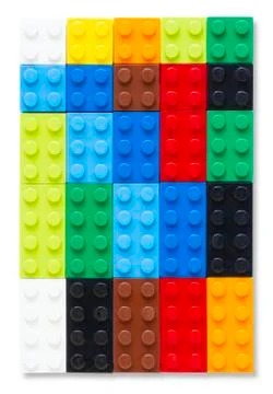 Multi-colored plastic building block on white background Stock Photos