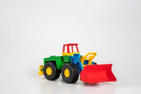 Multi-colored plastic children's toy cars on a white background. Foto stock