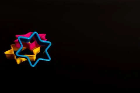 Multi-colored plastic cookie cutter for making cookies in the form of a star  Stock Photos