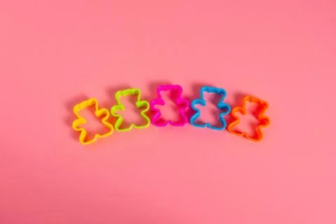 Multi-colored plastic cookie cutters for making cookies in the form of a tedd Stock Photos