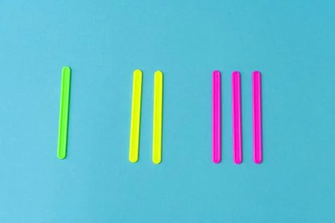 Multi-colored plastic counting sticks for learning counting Stock Photos