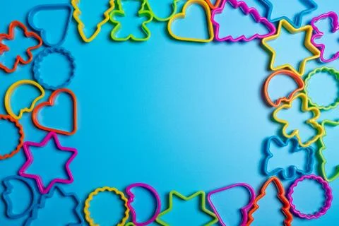 Multi-colored plastic forms of various shapes for the manufacture of cookies  Stock Photos