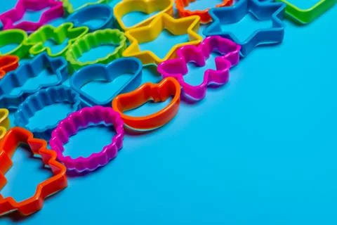Multi-colored plastic forms of various shapes for the manufacture of cookies  Stock Photos