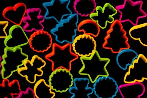 Multi-colored plastic molds of various shapes for the manufacture of cookies  Stock Photos