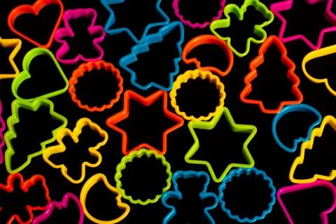 Multi-colored plastic molds of various shapes for the manufacture of cookies  Stock Photos