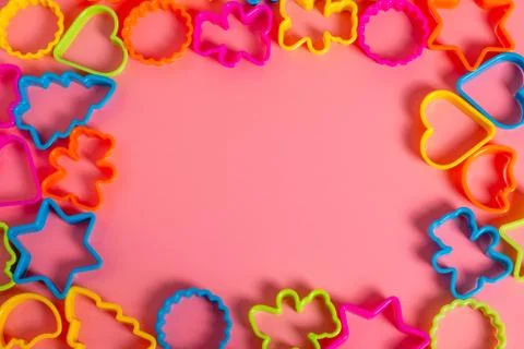 Multi-colored plastic molds of various shapes for the manufacture of cookies  Stock Photos