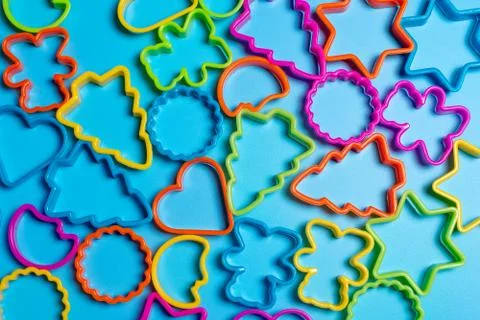 Multi-colored plastic molds of various shapes for the manufacture of cookies  Stock Photos