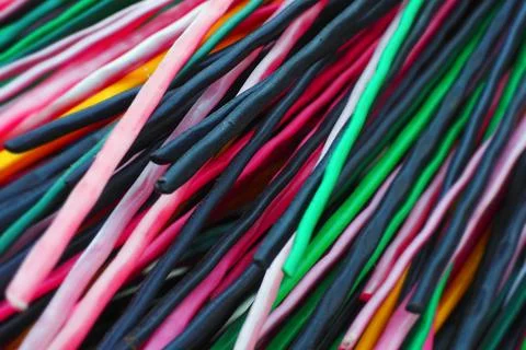 Multi-colored plastic rods for recycling and recyclables. Background in full Stock-Fotos