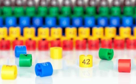 Multi-colored plastic size labels for hangers of clothing store. Stock Photos