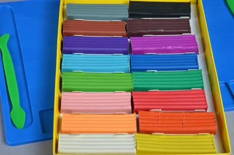 Multi-colored plasticine. Gray background. Top view. Stock Photos