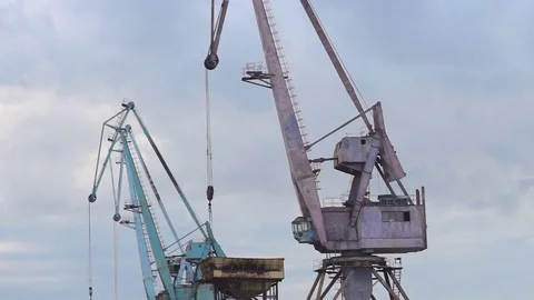 Multi-colored port gantry cranes against the sky Stock Footage 77576018