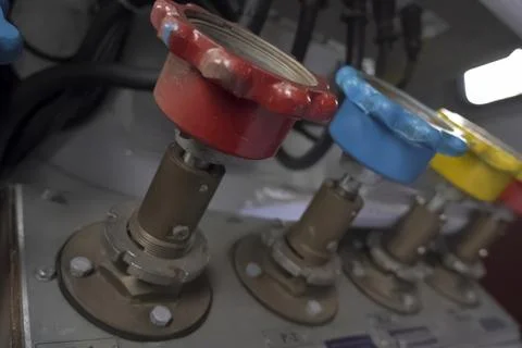 Multi-colored pressure gauges with convenient grippers for installation. Stock Photos
