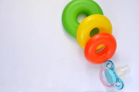 Multi-colored rattle on a white background   Foto stock