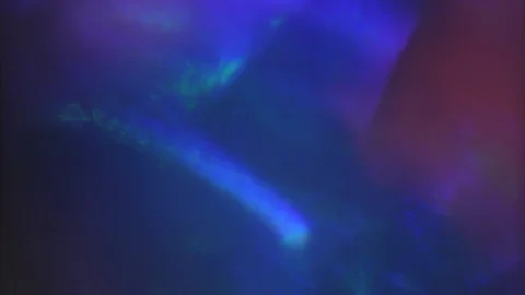 Multi-colored ray of light breaks through glass surface. Surrealistic Stock Footage 120483676