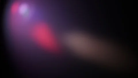 Multi-colored rays of light move randomly on a dark background Stock Footage 109404316