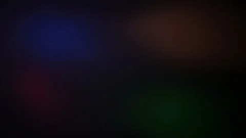 Multi-colored rays of light move randomly on a dark background Stock-Footage 109404339