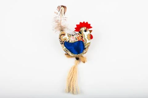 Multi-colored rooster, on a white background. View from above. Flat lay. Plus Fotos Stock