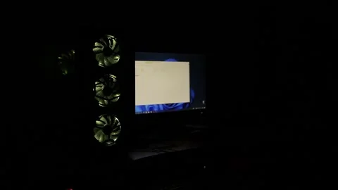 A multi-colored rotating cooler in a computer system unit against the background Stock Footage 264023520