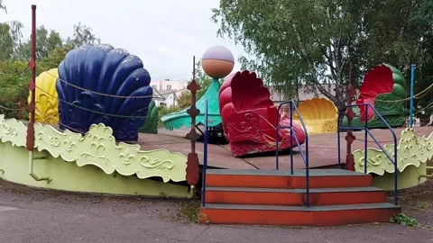 Multi-colored rotating shells in the carousel park, childrens attraction Stock Footage 303142894