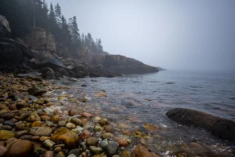 Multi-colored round rocks on Little Hunters Beach in Acadia National Park, Maine Stock Photos