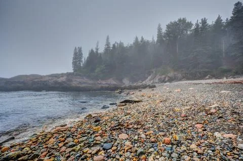 Multi-colored round rocks on Little Hunters Beach in Acadia National Park, Maine Stock Photos