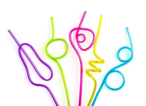 Multi-colored semi-transparent in many shapes straw. Fotos de archivo