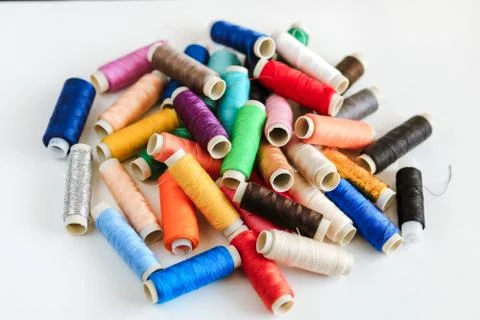 Multi-colored sewing threads Stock Photos