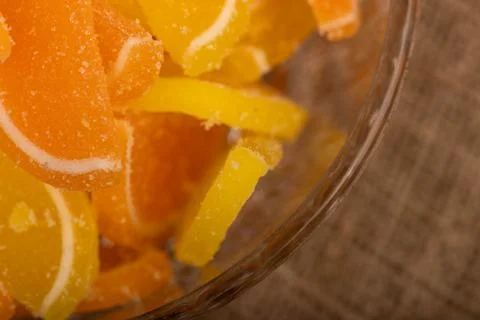 Multi-colored shaped marmalade lemon slices in a glass vase, close-up, select Stock Photos