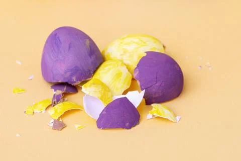 Multi-colored shells from chicken Easter eggs on pastel background. Stock Photos