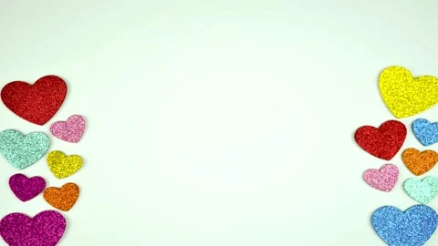 Multi-colored shiny hearts move from bottom to top on a white background Stock Footage 216831428