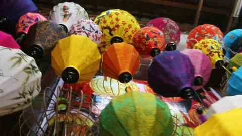 Multi-colored silk lanterns swaying in the wind Stock Footage 246845179