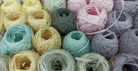 Multi-colored skeins of thread folded in a stack close-up Stock Photos
